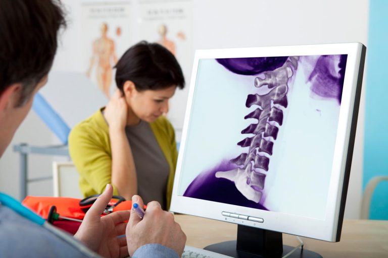 Detail of female therapist manipulating shoulder blade on patient Scranton Law Firm Scranton Law Firm